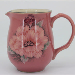 Denby - Damask - Milk Jug -Pink ceramic pitcher with floral design on a white background