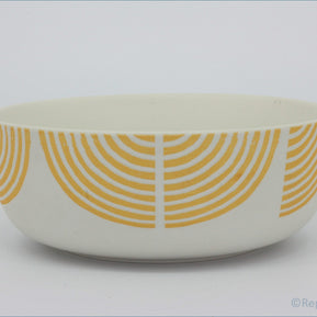 Habitat - Block Print - Cereal Bowl - White bowl with orange circular pattern on a white background