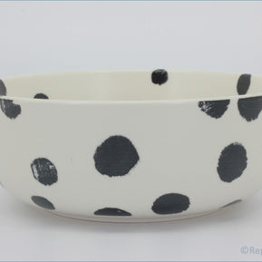 Habitat - Global - Cereal Bowl - White ceramic bowl with black polka dots on a white background