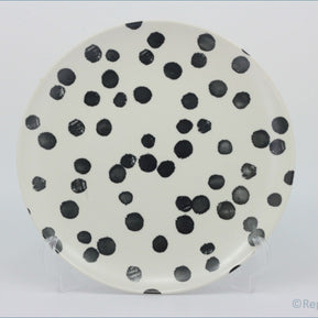 Habitat - Global - Dinner Plate - Round ceramic plate with black polka dots on a white background