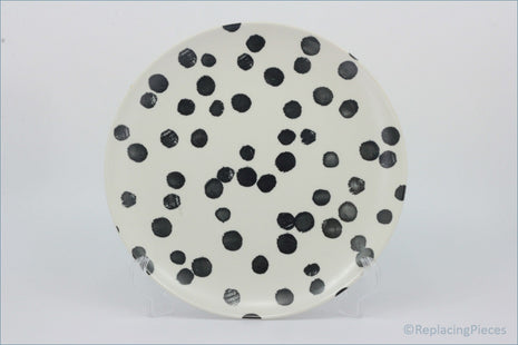 Habitat - Global - Dinner Plate - Round ceramic plate with black polka dots on a white background