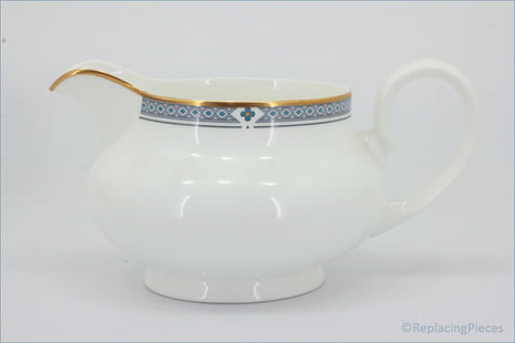 Marks & Spencer - Felsham - Gravy Boat - White ceramic pitcher with decorative blue band and gold handle on a white background