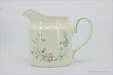 Minton - Brookwood - Milk Jug - Cream-colored ceramic pitcher with floral patterns on a white background