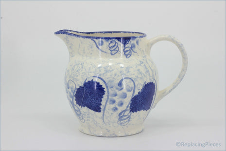 Poole - Blue Vine - 1 Pint Jug  - White ceramic pitcher with blue floral patterns on a white background
