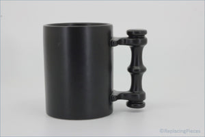 Portmeirion - Mugs - Plain Black Tankard - Black mug with a unique handle design on a white background