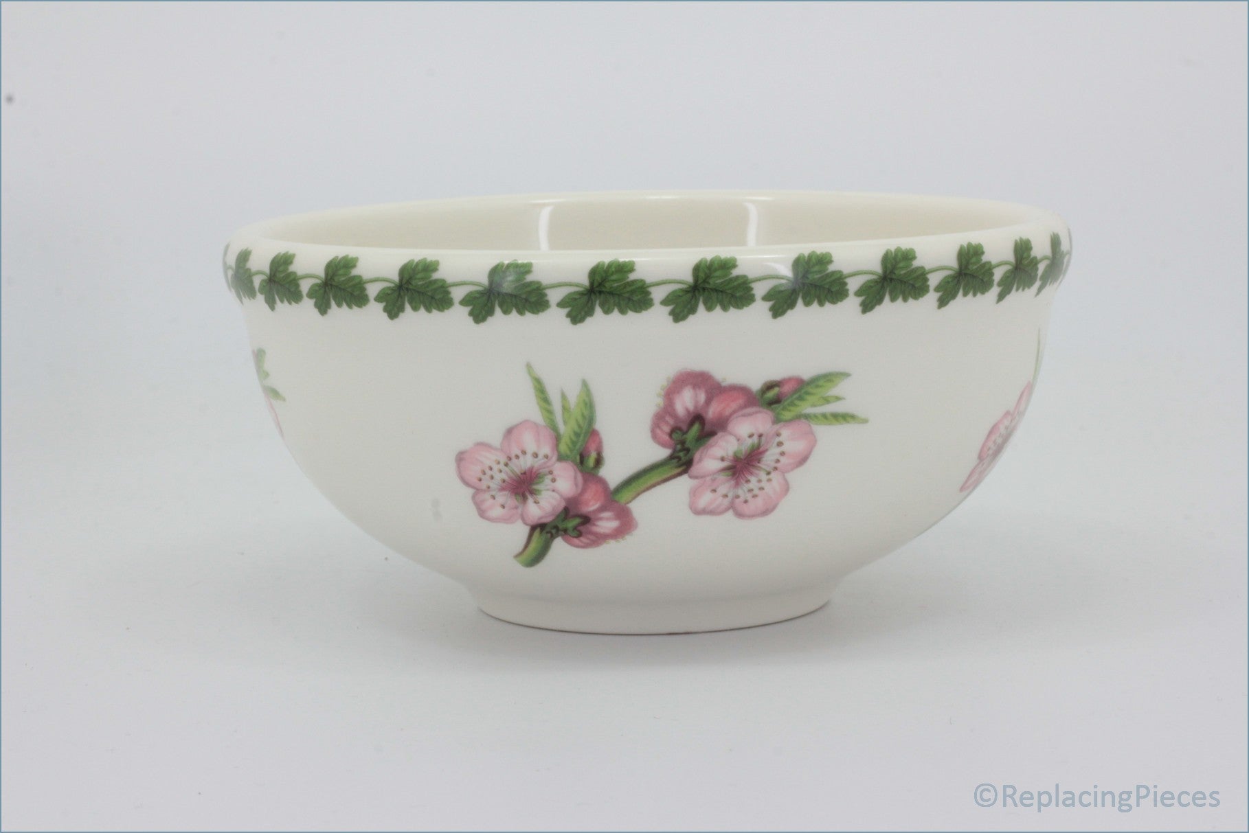 White ceramic bowl with floral design on a white background - Portmeirion - Pomona - 5 1/2
