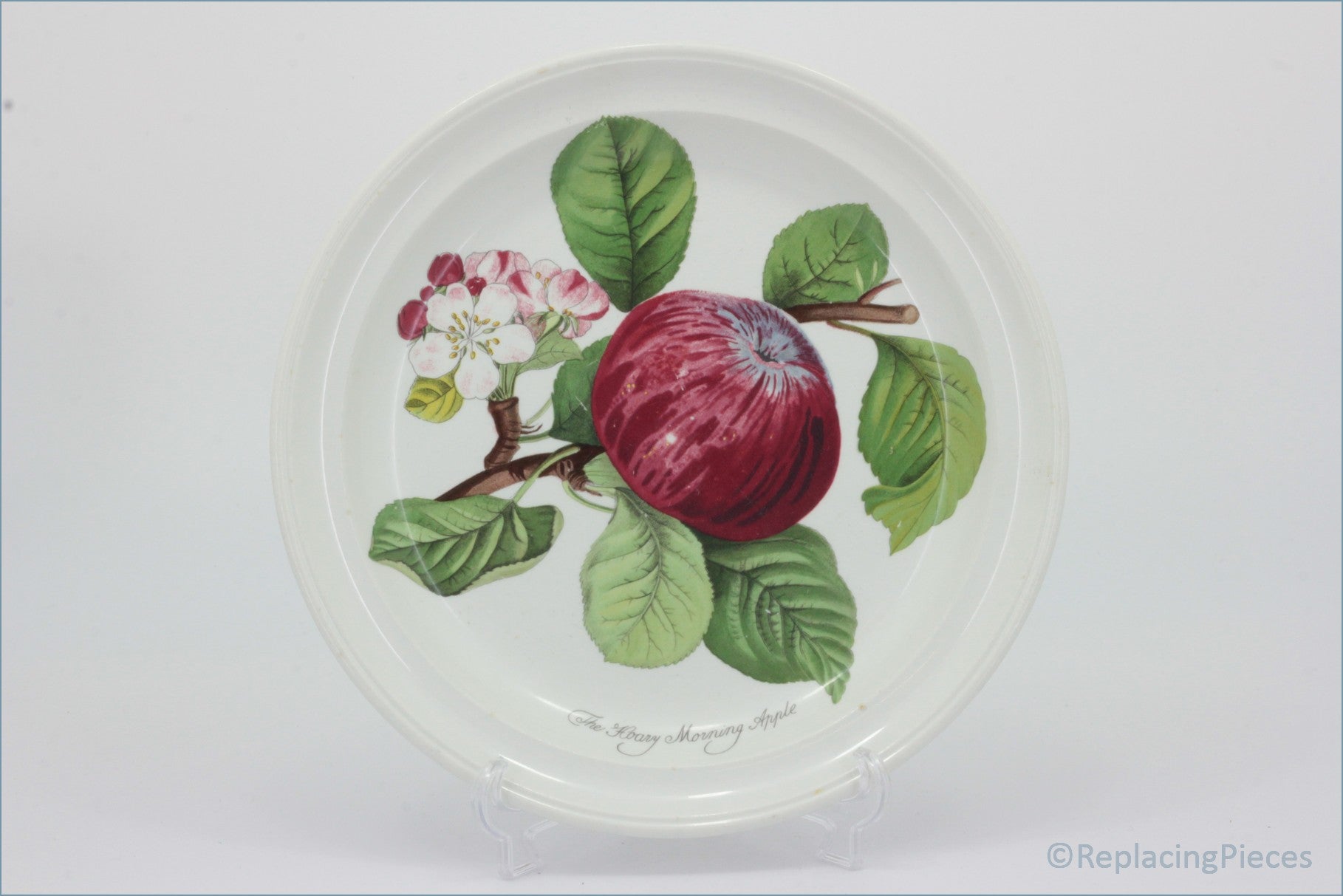 Decorative plate with a red apple and green leaves on a white background - Portmeirion - Pomona - 8 5/8