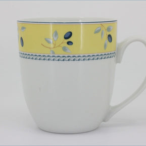 Royal Doulton - Blueberry (Yellow Rim) - Mug - White mug with yellow top section and blue floral design on a white background