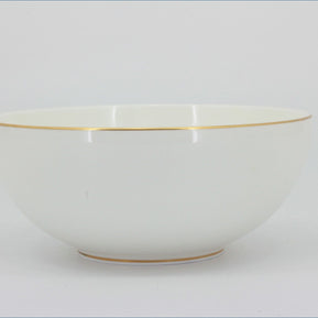 White ceramic bowl with gold rim on a light gray background - Royal Doulton - Symmetry Gold - Cereal Bowl