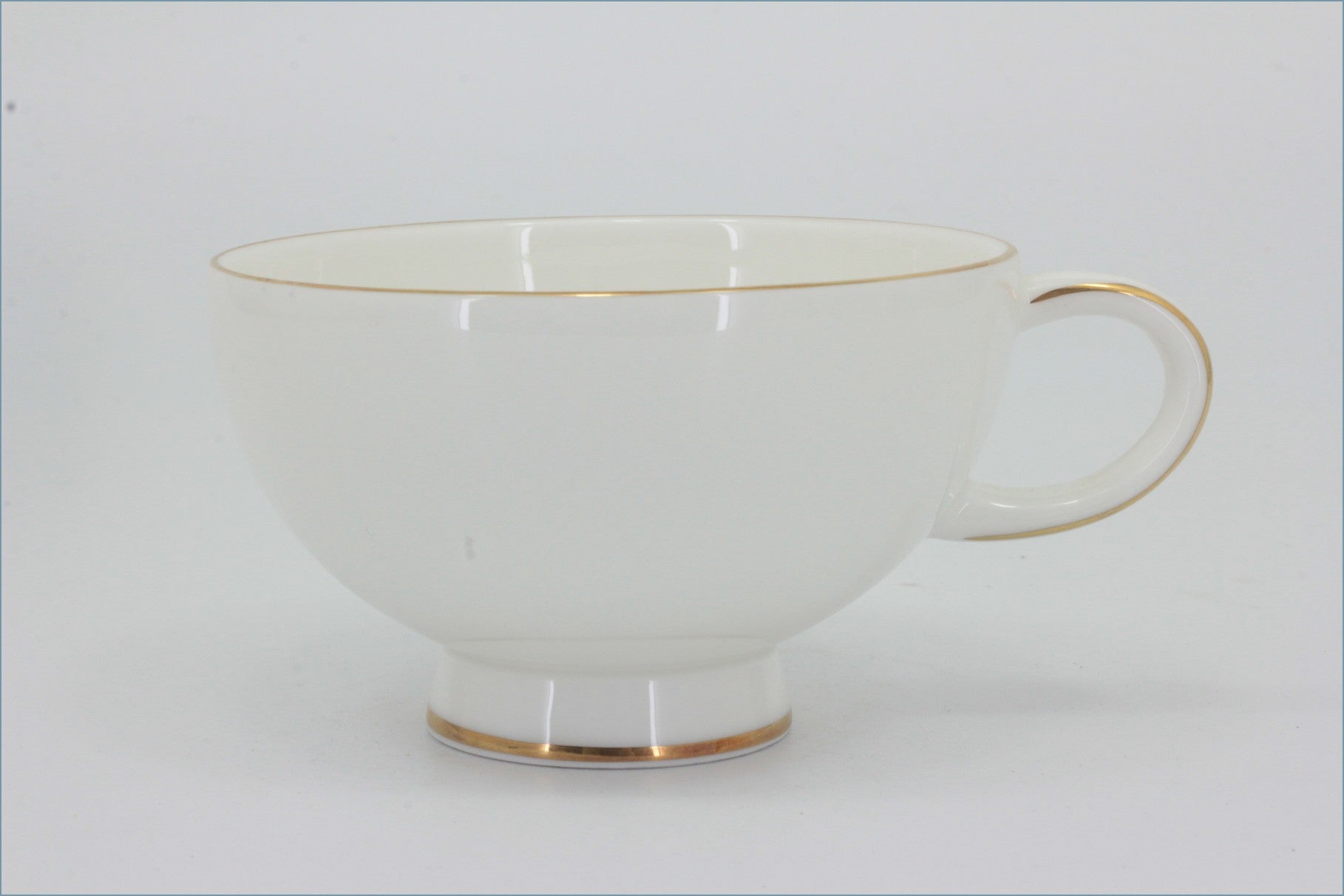 Royal Doulton - Symmetry Gold - Teacup - White teacup with gold trim on a white background